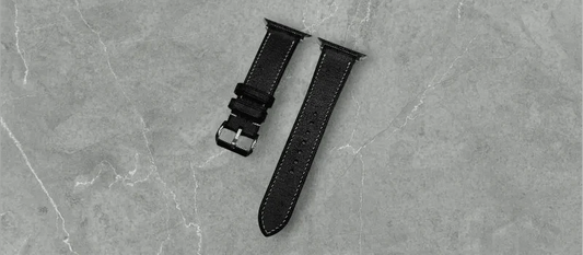 Elegant Black Babele leather Apple Watch band on a wrist, enhancing a classic look