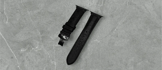 Premium Black Pueblo Leather Apple Watch band on a wooden table, reflecting luxury and style