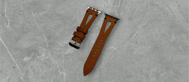 Classic light brown Pueblo leather Apple Watch band laid elegantly on a wooden surface