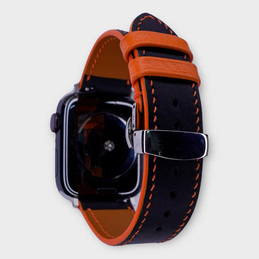 Striking apple watch leather band in black and orange Swift leather, vibrant and bold.