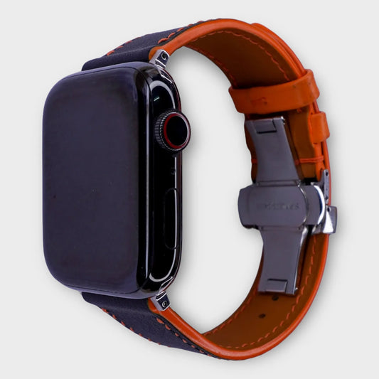 Leather Apple Watch band in black with orange accents, Swift leather for a bold statement.