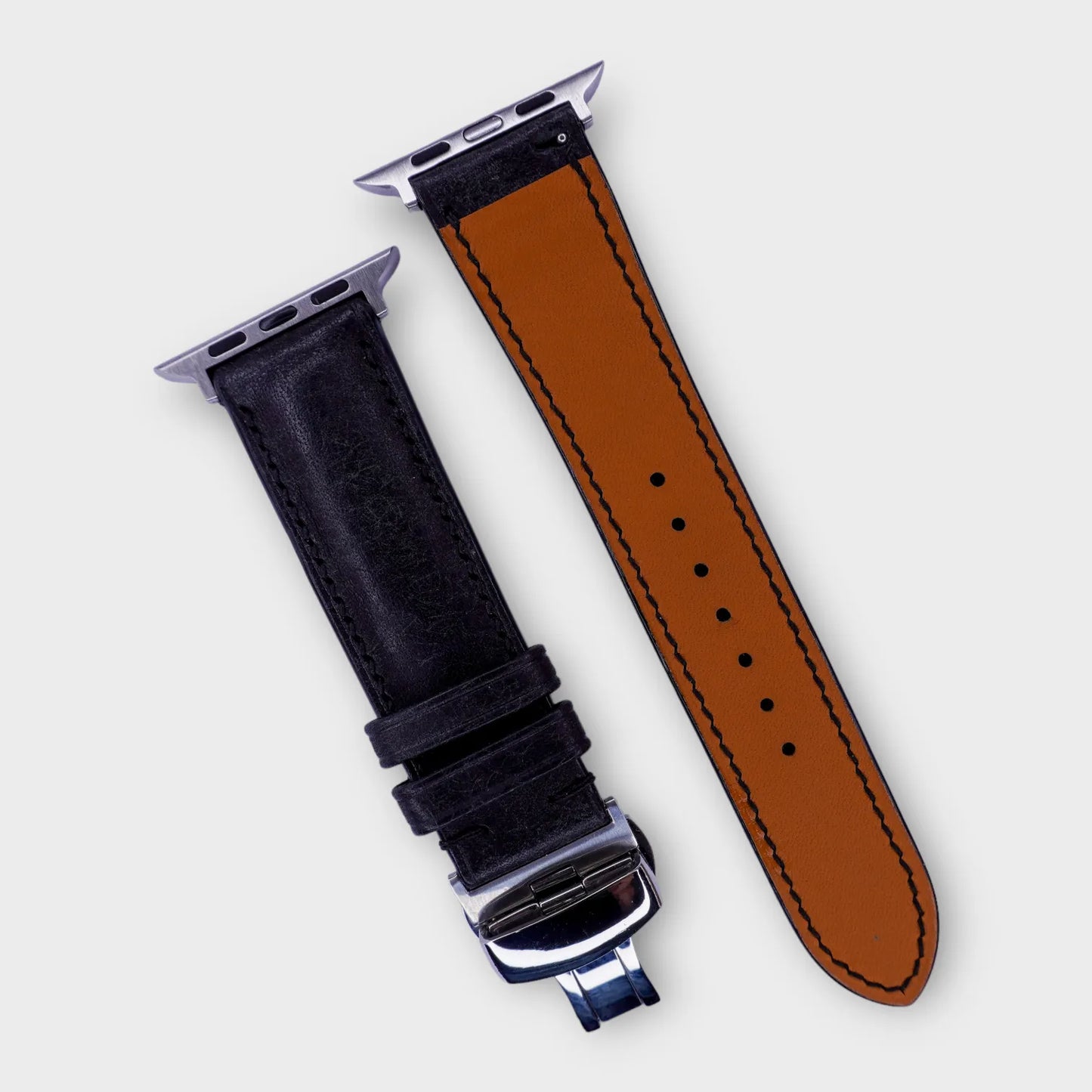 Iconic black leather Apple Watch band in Pueblo leather, embodies classic ruggedness.