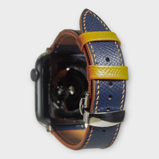 Apple watch bands in blue Epsom leather with striking orange stitching, perfect for a stylish, colorful look.
