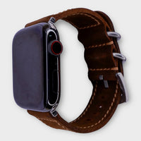Sophisticated leather Apple Watch band crafted from dark brown waxy leather.