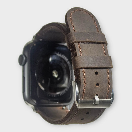Apple watch bands in dark brown waxy leather, blending rugged durability with classic elegance.