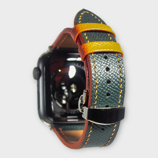 Apple watch bands in green Epsom leather with bold orange stitching, a vibrant accessory for any style.