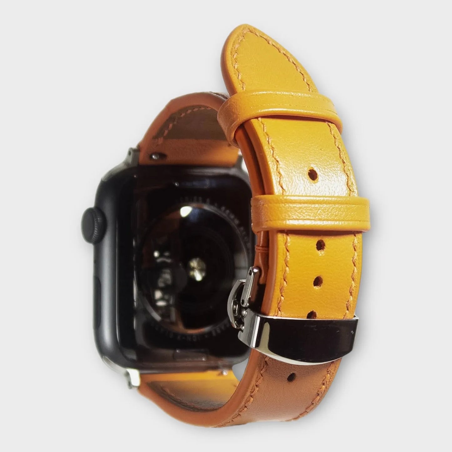 Apple watch bands in vibrant orange Swift leather, elegant and eye-catching for stylish wear.