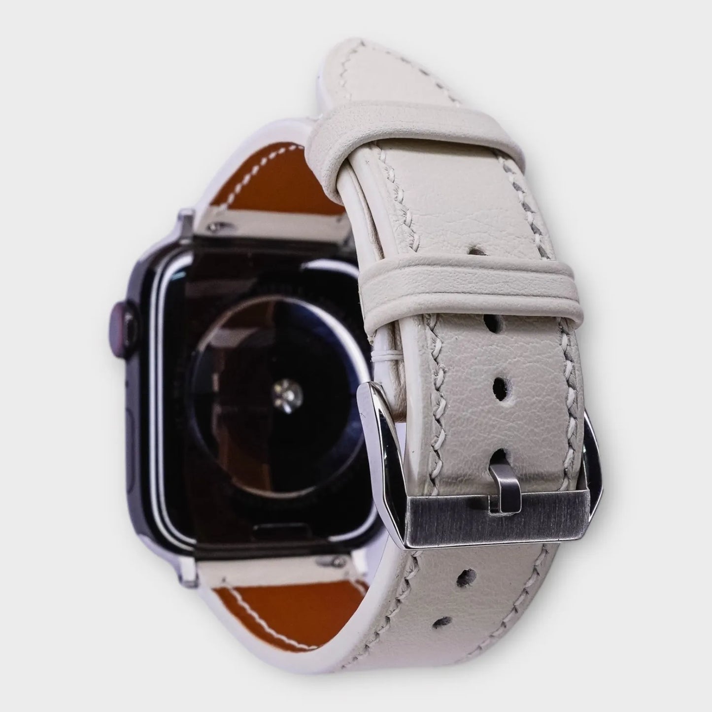 Chic apple watch leather band in white French Swift leather, epitome of elegance.