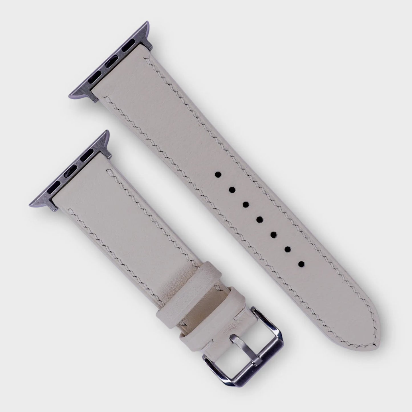 Sophisticated leather watch bands in white French Swift leather, detailing elegance.