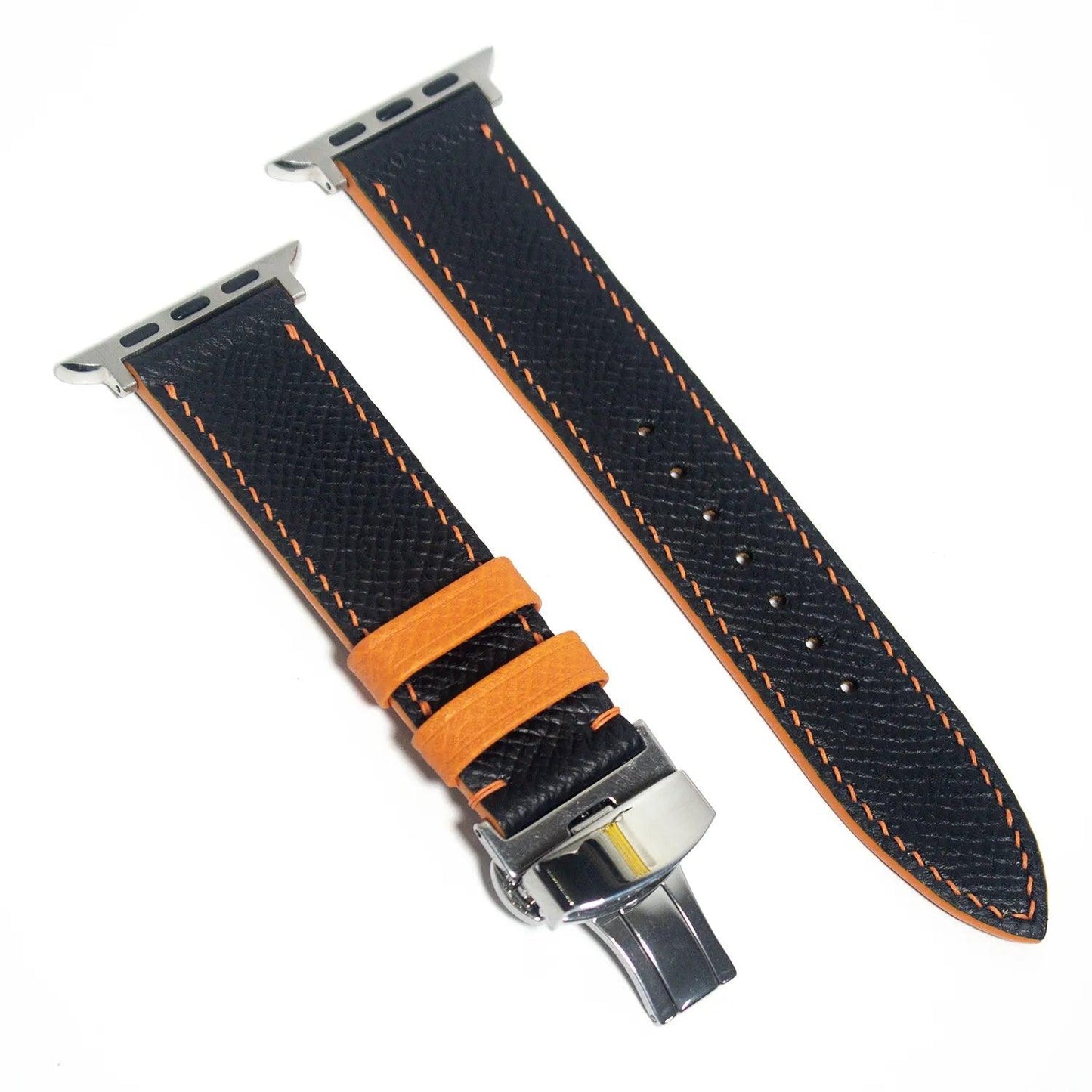 Chic leather Apple Watch band in black Epsom leather with eye-catching orange stitching, perfect for stylish tech enthusiasts.