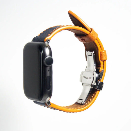 Distinctive apple watch leather band crafted from blue Epsom leather accented with vibrant orange stitching.