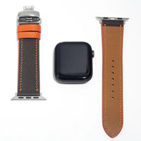 Durable leather watch straps in brown Epsom leather, featuring orange stitching for an extra touch of elegance.