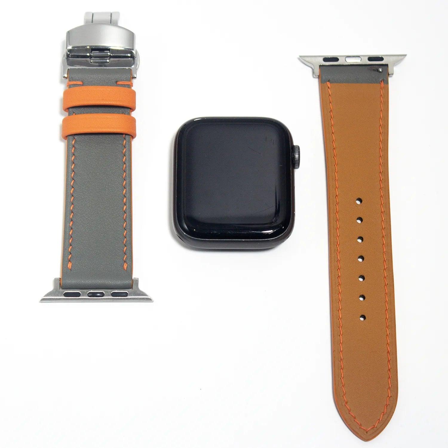Durable leather watch straps in gray Swift leather, finished with bold orange stitching for added flair.
