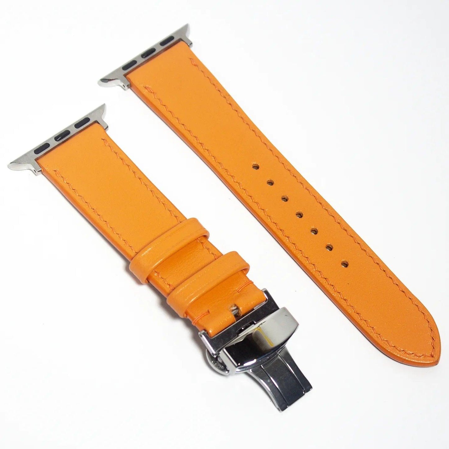 Upgrade your accessory game with this leather Apple Watch band in luxurious orange Swift leather, embodying elegance and vibrancy.