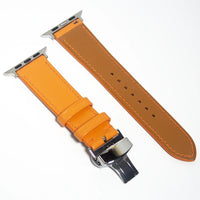 Distinctive leather watch bands made from orange Swift leather, perfect for adding a pop of color and elegance to your look.